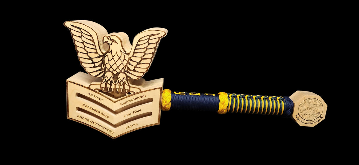 Finished custom rank mallet with engraved crow head, wrapped handle, and pommel