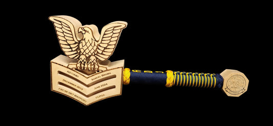 Finished custom rank mallet with engraved crow head, wrapped handle, and pommel
