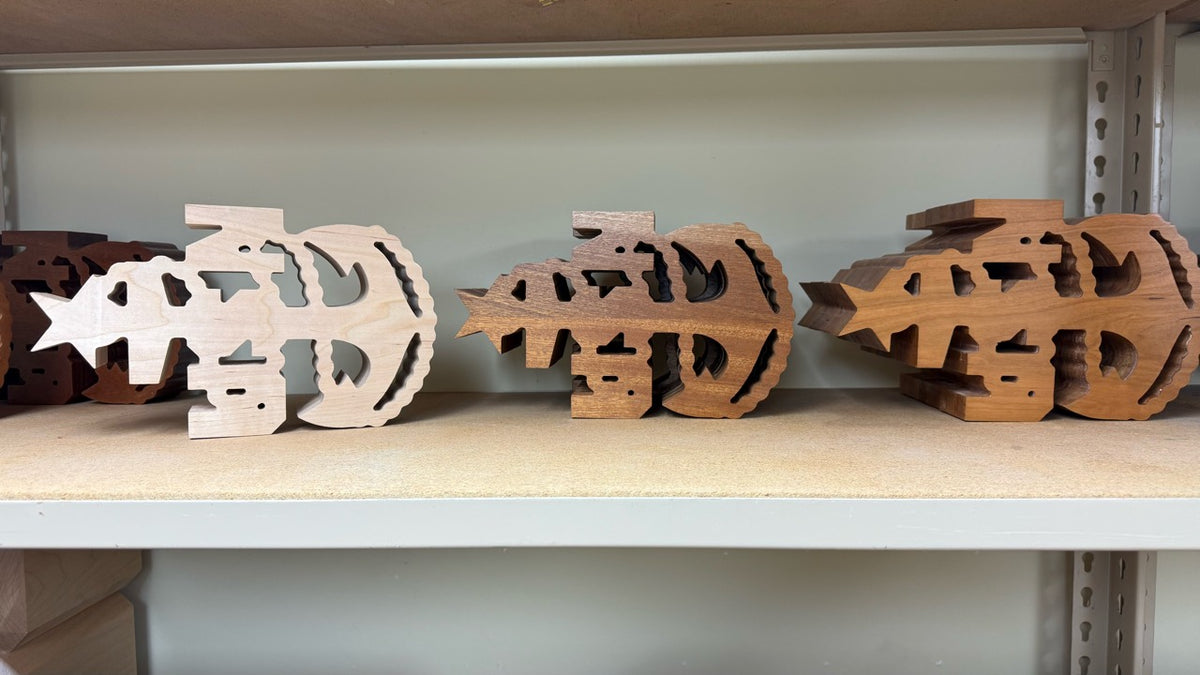 Actual blank SCPO rank mallet heads in maple, sapele, and cherry from left to right