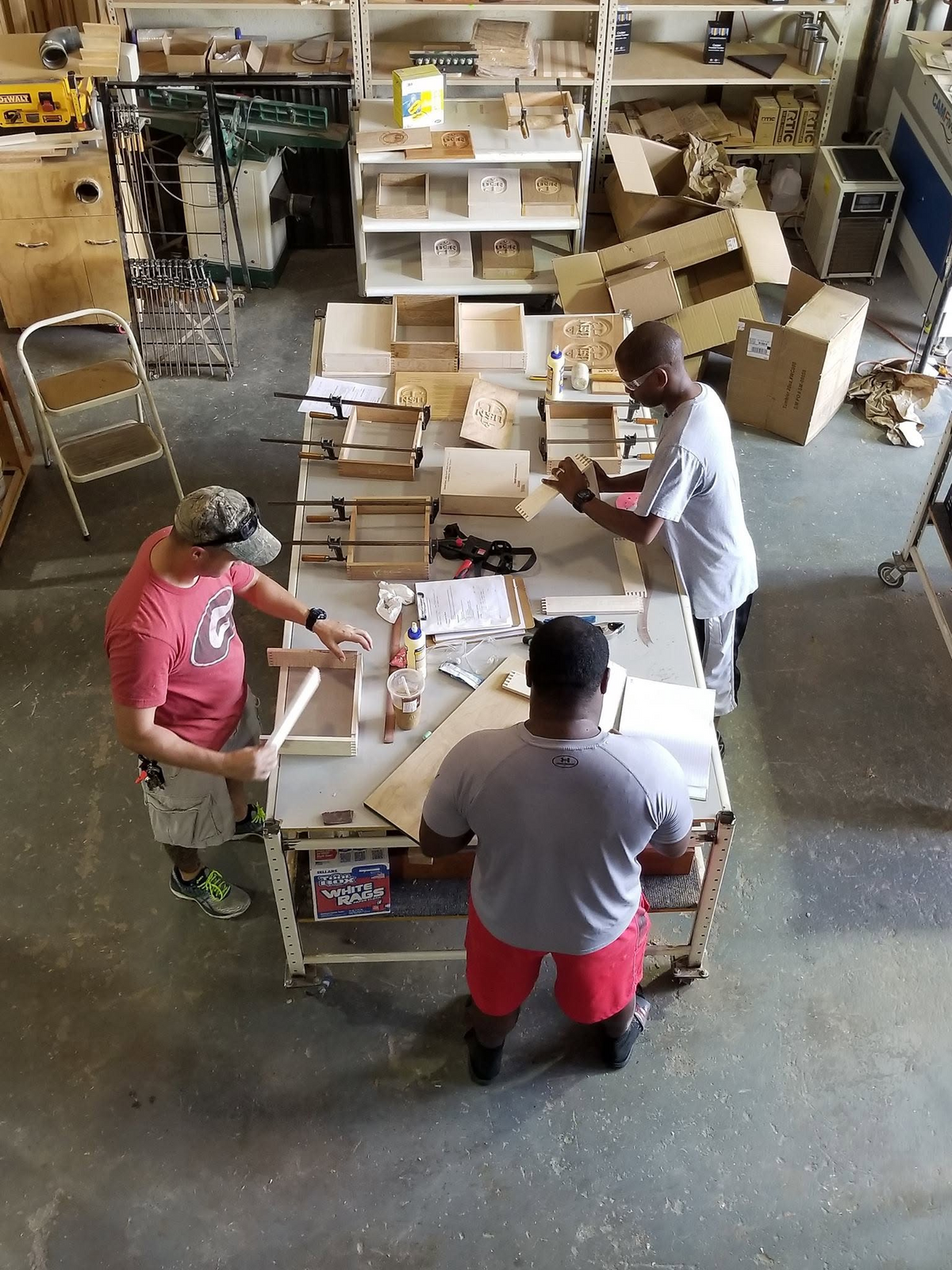 Chief Selects assembling wooden vessels in the workshop