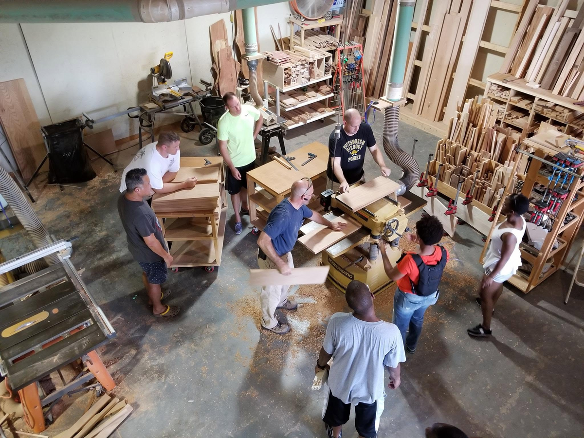 Chief Selects participating in vessel building at Old Goat Custom Woods