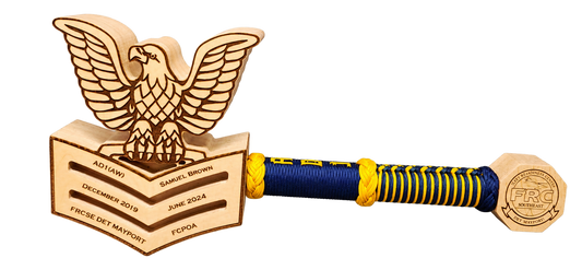 Engraved rank mallet with navy and yellow wrapped handle and pommel, isolated on a transparent background
